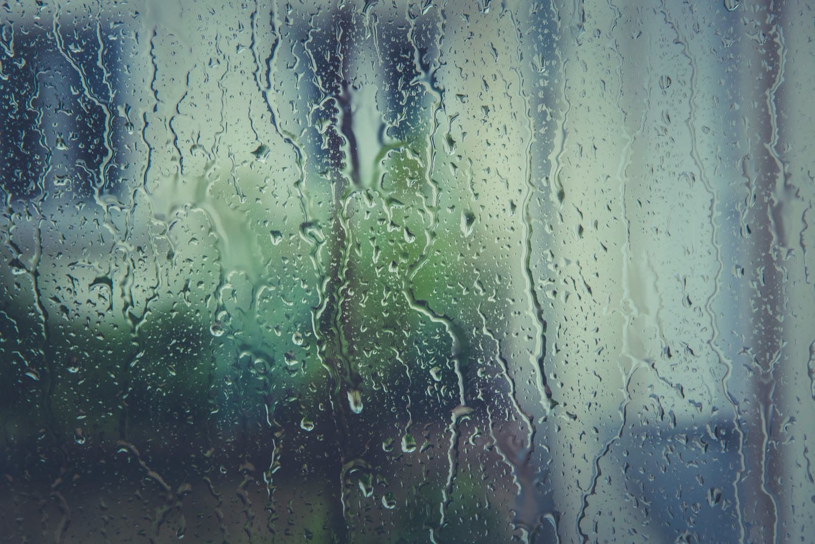 Close-up of rain running down a window